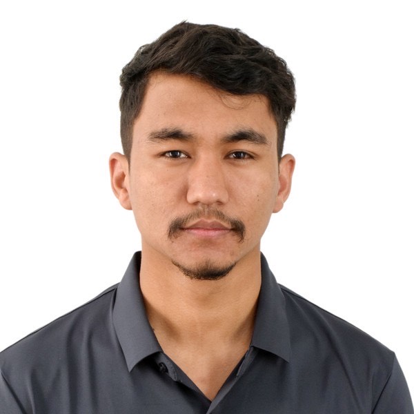 A headshot of Mukesh Shrestha, a project manager, smiling at the camera
